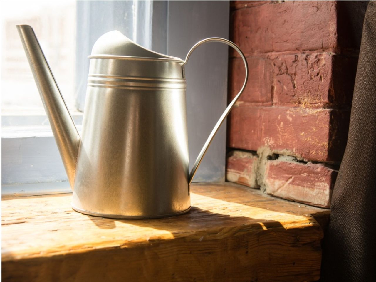 Watering Can On A Windowsill