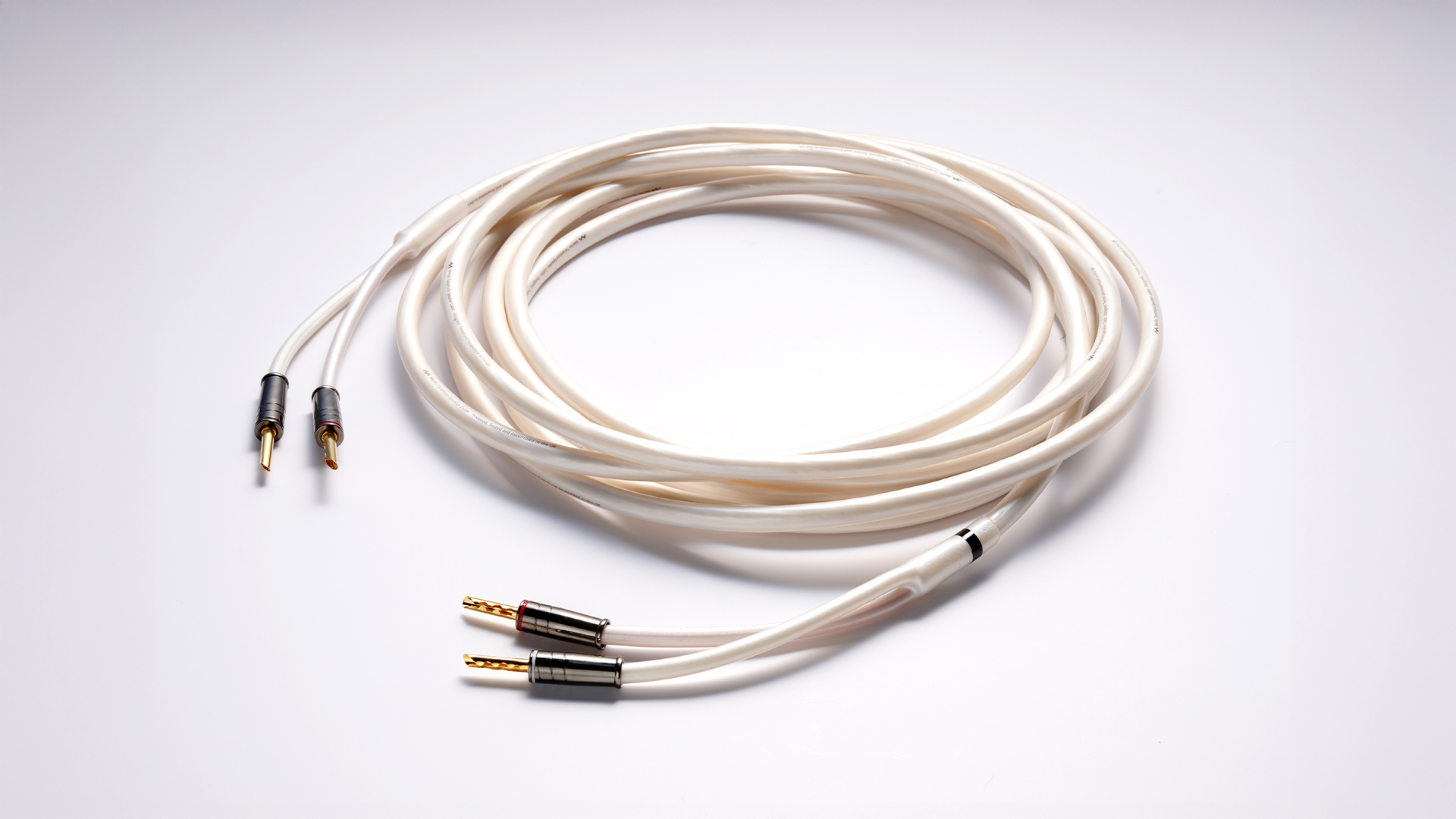 Merlin Tarantula speaker cable coiled on white surface
