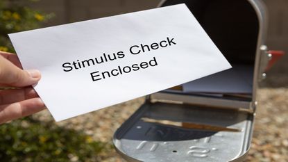 picture of stimulus check enveloped taken out of mailbox