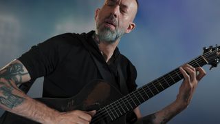 A photo of Jon Gomm playing a guitar equipped with a Fishman Jon Gomm Signature Series Powertap Earth Pro pickup system