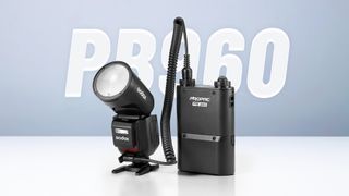 Godox V1Pro next to a battery pack with text behind