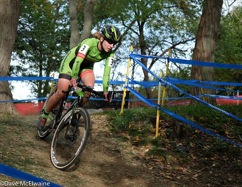 Emma White (Cannondale) riding through the woods with one lap remaining