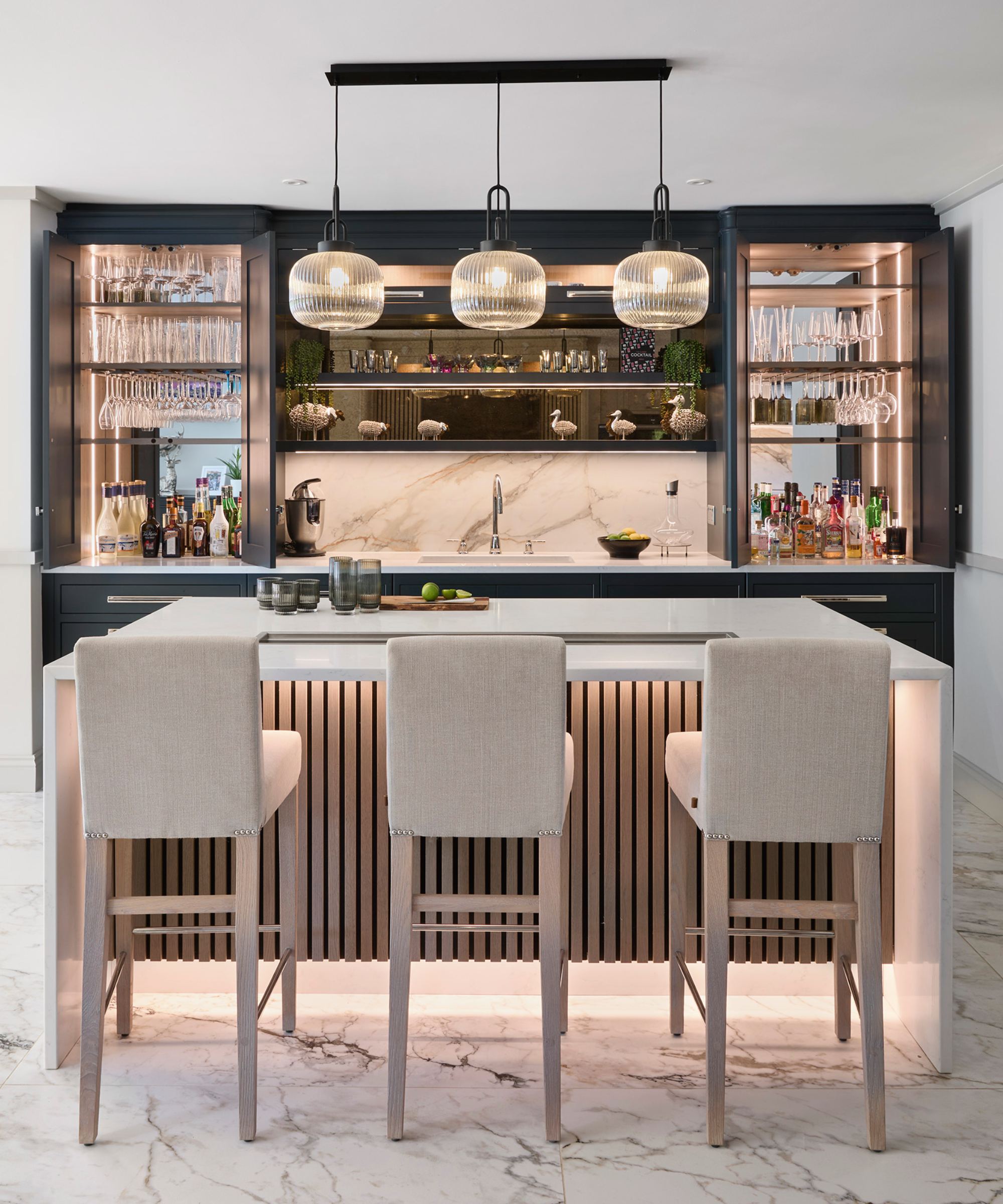 Kitchen with home bar and breakfast bar with stools