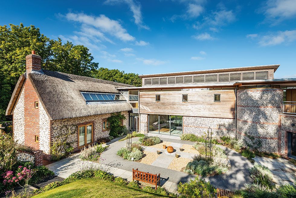 flint and timber cladding on self build house