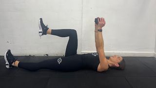 Personal trainer Emily Rutherwood performing a dumbbell deadbug