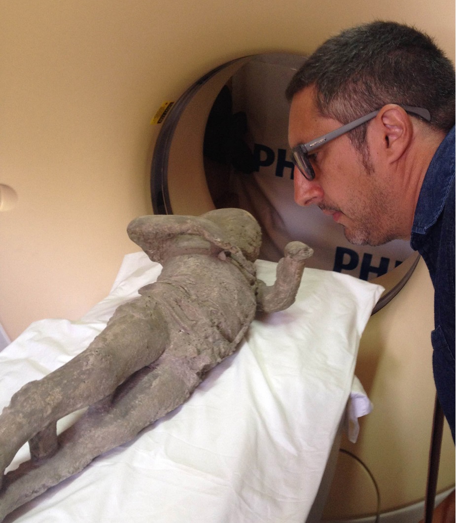 Archeologist Lloren&amp;ccedil; Alapont among some of the plaster casts of the victims at Pompeii.