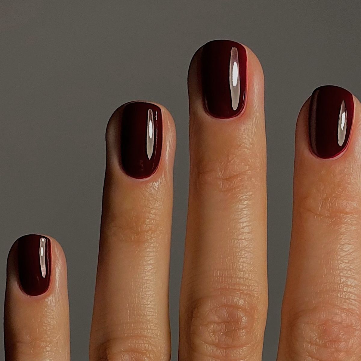 A close up of nails painted with Hollyhock by Manucurist