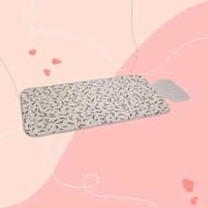 Ironing mat on pink graphic background
