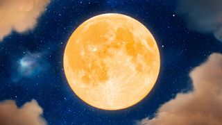 New Moon January 2023: Big yellow full moon up in the sky surrounded by clouds.