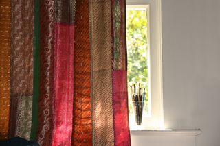 Handmade colorful textile curtain and window sill