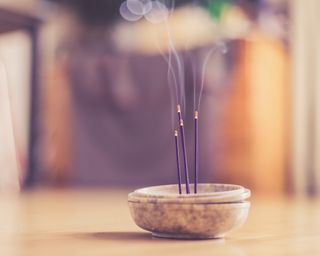 Smoking and smelling joss sticks at home