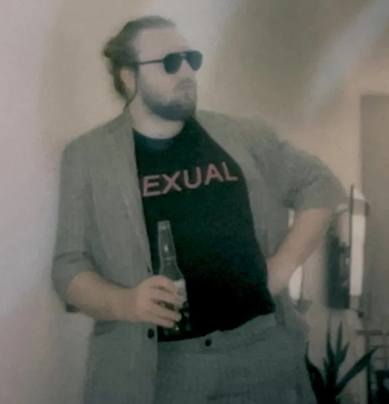 Developer Hugh Monahan wearing a shirt that says "Exual" on it.