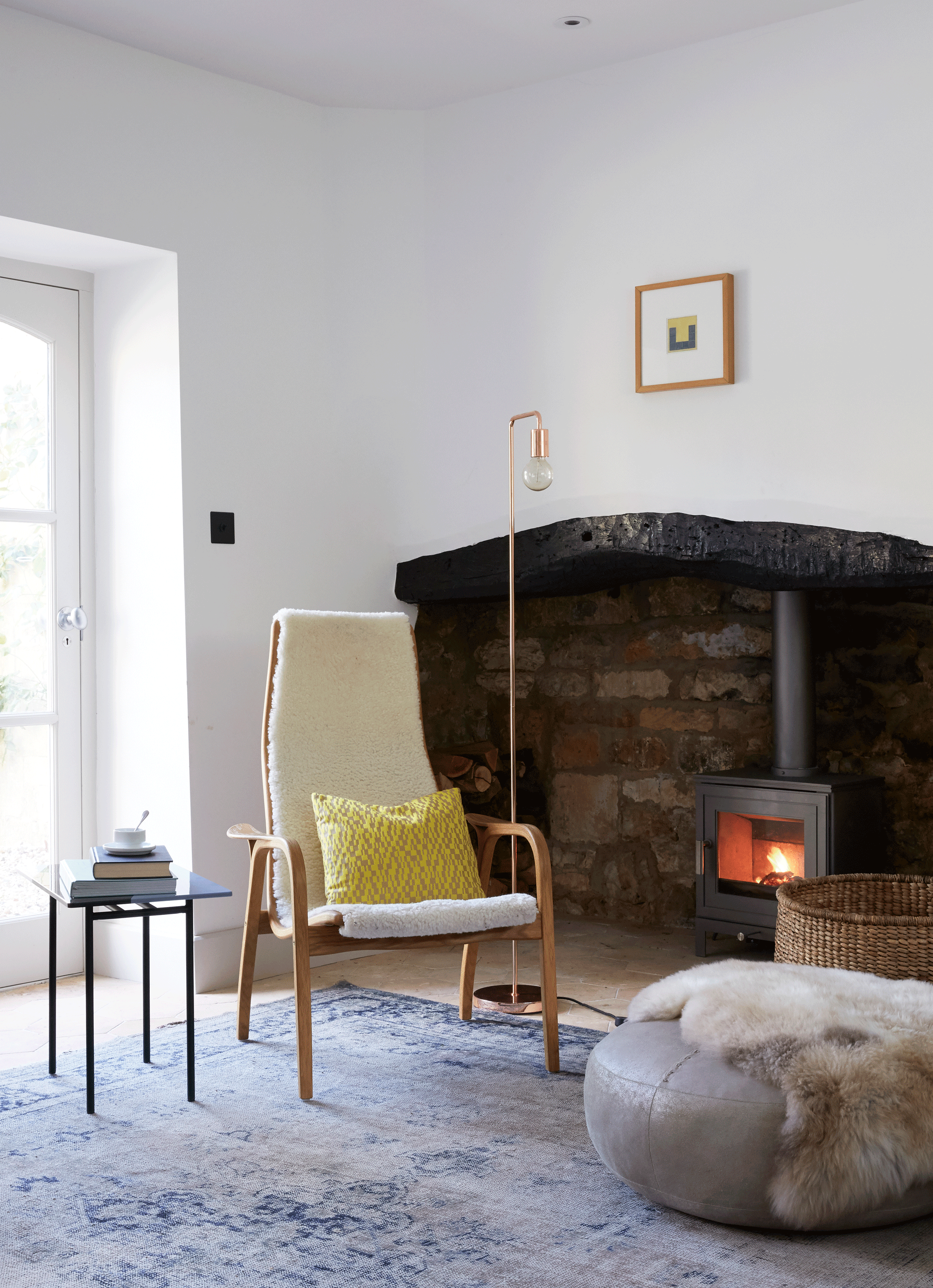 cosy reading corner by open fire