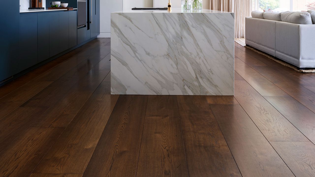 modern luxury kitchen with marble kitchen island and wide plank oak flooring