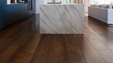 modern luxury kitchen with marble kitchen island and wide plank oak flooring