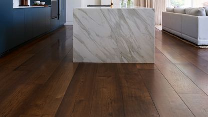 modern luxury kitchen with marble kitchen island and wide plank oak flooring