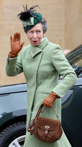 Princess Anne, Princess Royal waves as she arrives to attend the Easter Matins Service at Windsor Castle on March 31, 2024