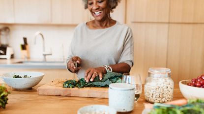 Woman cooking with immunity-boosting foods