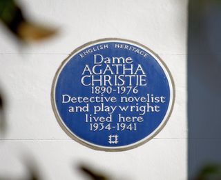 blue plaque marking a former home of novelist agatha christie, in sheffield terrace, kensington, london, england