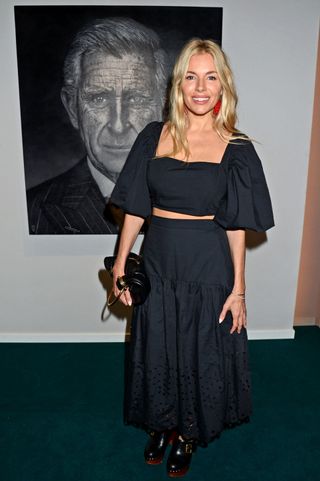 Sienna Miller wears a two piece and clogs