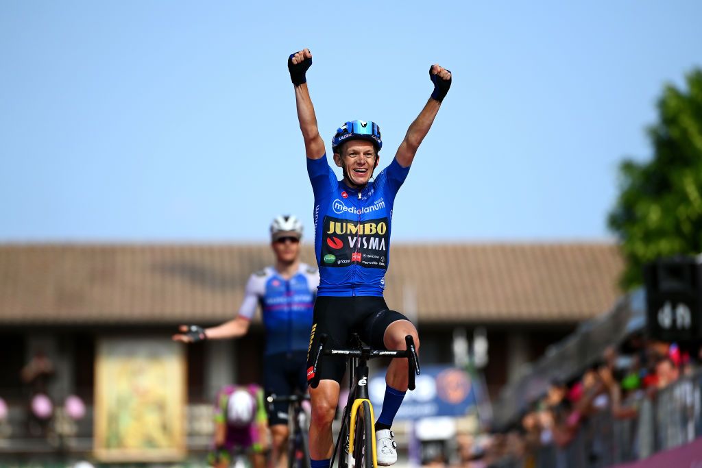 SANTUARIO DI CASTELMONTE ITALY MAY 27 Koen Bouwman of Netherlands and Team Jumbo Visma Team Blue Mountain Jersey celebrates at finish line as stage winner ahead of Mauro Schmid of Switzerland and Team QuickStep Alpha Vinyl during the 105th Giro dItalia 2022 Stage 19 a 178km stage from Marano Lagunare to Santuario di Castelmonte 577m Giro WorldTour on May 27 2022 in Santuario di Castelmonte Italy Photo by Tim de WaeleGetty Images