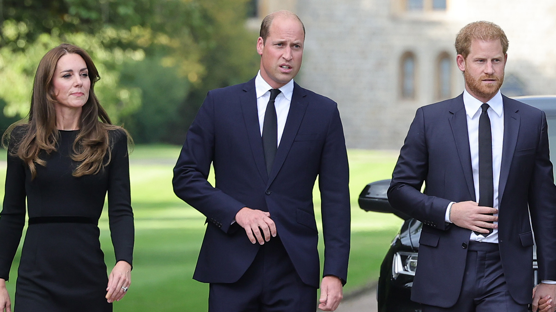 WINDSOR, ENGLAND - SEPTEMBER 10: Catherine, Princess of Wales, Prince William, Prince of Wales, Prince Harry, Duke of Sussex, and Meghan, Duchess of Sussex on the long Walk at Windsor Castle arrive to view flowers and tributes to HM Queen Elizabeth on September 10, 2022 in Windsor, England. Crowds have gathered and tributes left at the gates of Windsor Castle to Queen Elizabeth II, who died at Balmoral Castle on 8 September, 2022. (Photo by Chris Jackson/Getty Images)
