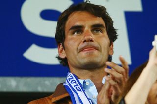 Roger Federer watching his team FC Basel against Chelsea in the Europa League in 2013.