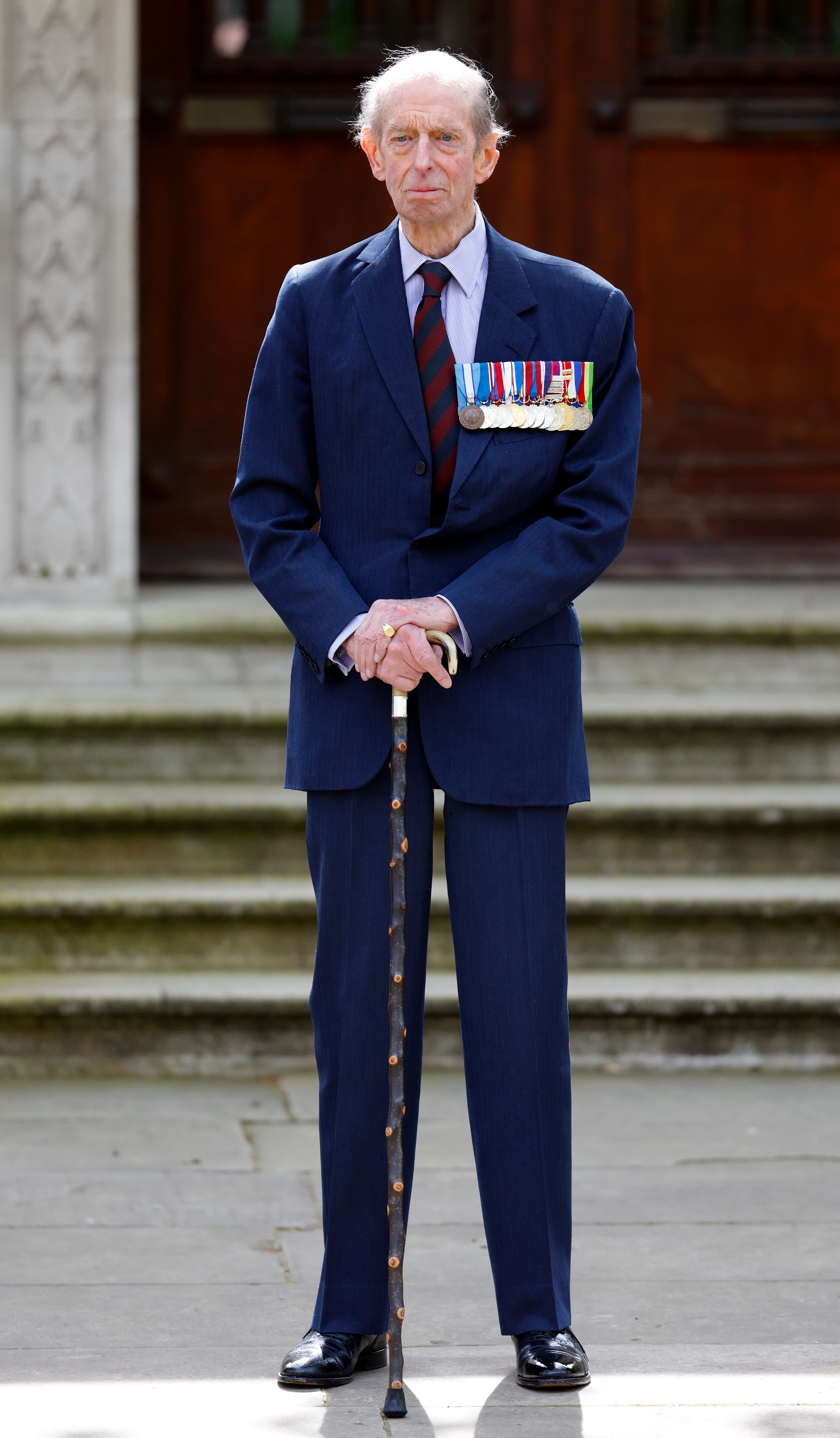 The Duke of Kent wearing a blue suit and military medals