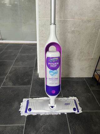 a purple and white Swiffer power mop