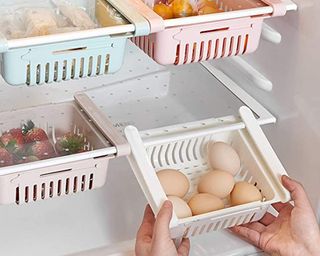 A set of retractable drawer organizers in refrigerator