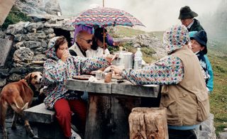 Photograph of the Missoni family outdoors having a meal