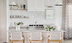 A kitchen with white zellige tiles