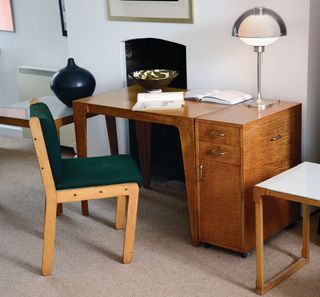 Wooden desk with chair and greencushion pad