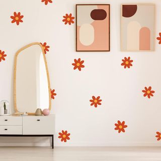 orange flower wall decals on a white wall