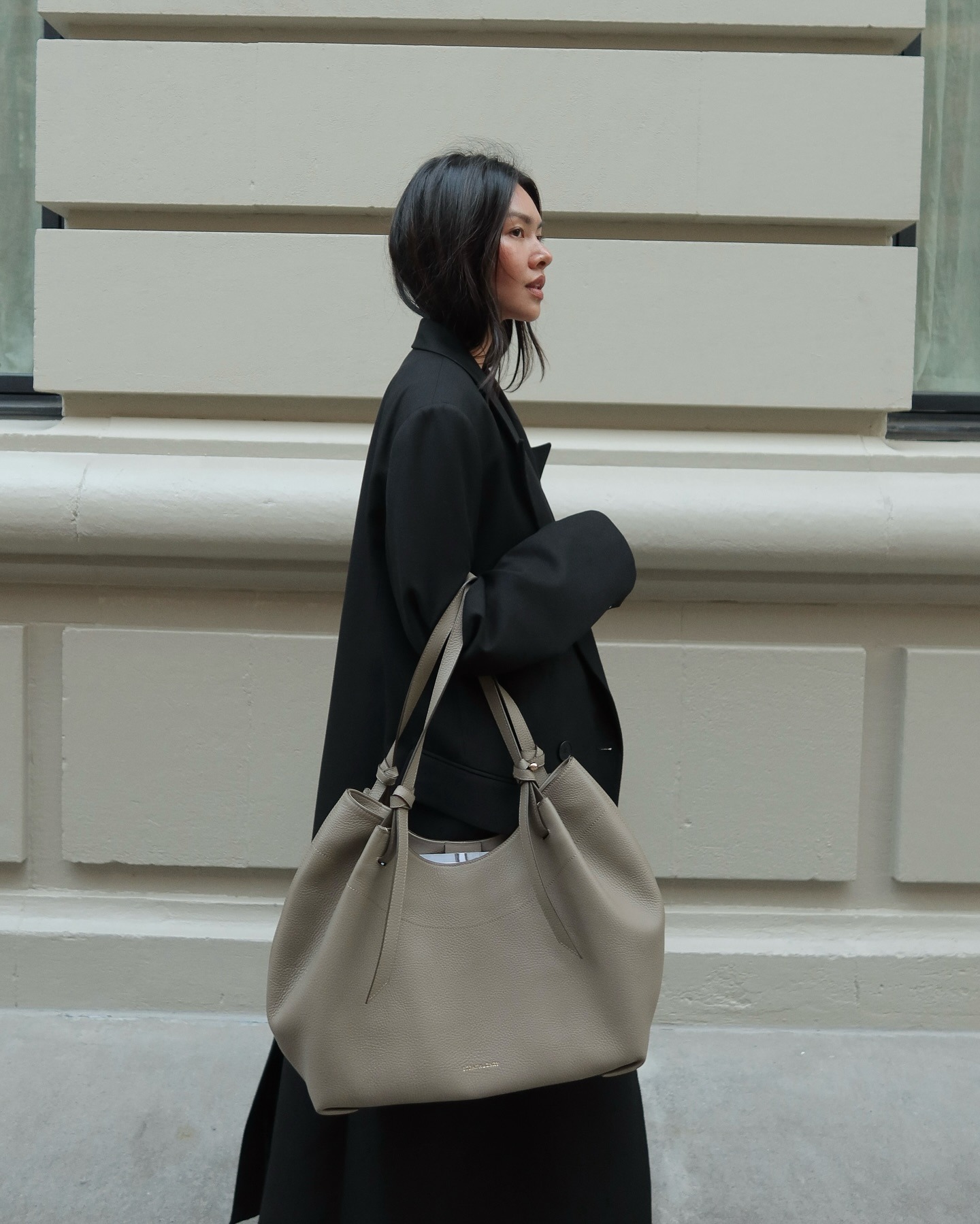 Mimi wearing the Strathberry Barra tote