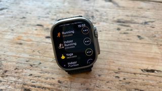 WorkOutDoors app screen on Apple Watch. Text reads Running, Indoor Running, Yoga