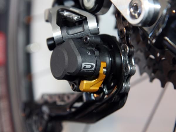 Flick the Shadow Plus switch "off" on Shimano's latest XTR rear deraillleur to allow the pulley cage to rotate freely in both directions when removing the rear wheel.