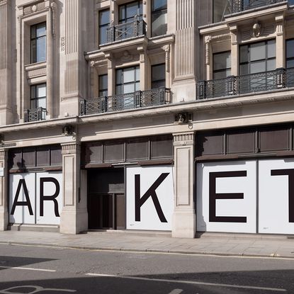 building with black windows and ARKET store