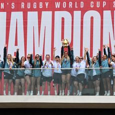 England's captain Zoe Aldcroft lifts the trophy as England players celebrate at a Red Roses Champions Party, held at Battersea Power Station in central London on September 28, 2025, after their win in the final of the Women's Rugby World Cup against Canada the previous day
