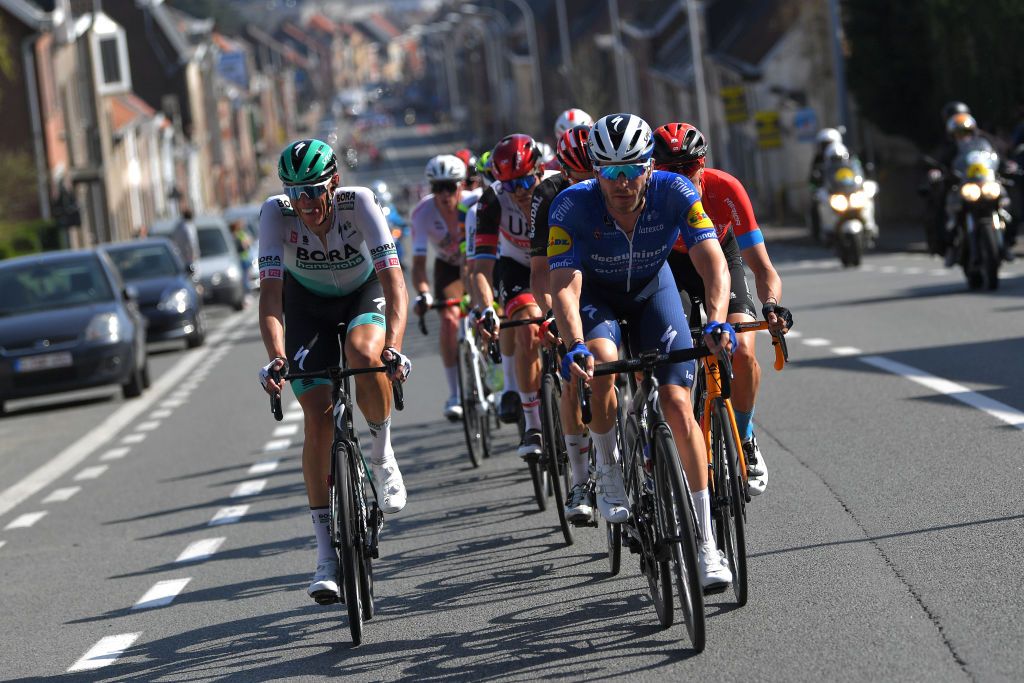 WAREGEM BELGIUM MARCH 31 Nils Politt of Germany and Team Bora Hansgrohe Florian Senechal of France and Team Deceuninck QuickStep Dylan Teuns of Belgium and Team Bahrain Victorious during the 75th Dwars Door Vlaanderen 2021 Mens Elite a 1841km race from Roeselare to Waregem DDV DDV21 FlandersClassic A travers la Flandre on March 31 2021 in Waregem Belgium Photo by Luc ClaessenGetty Images