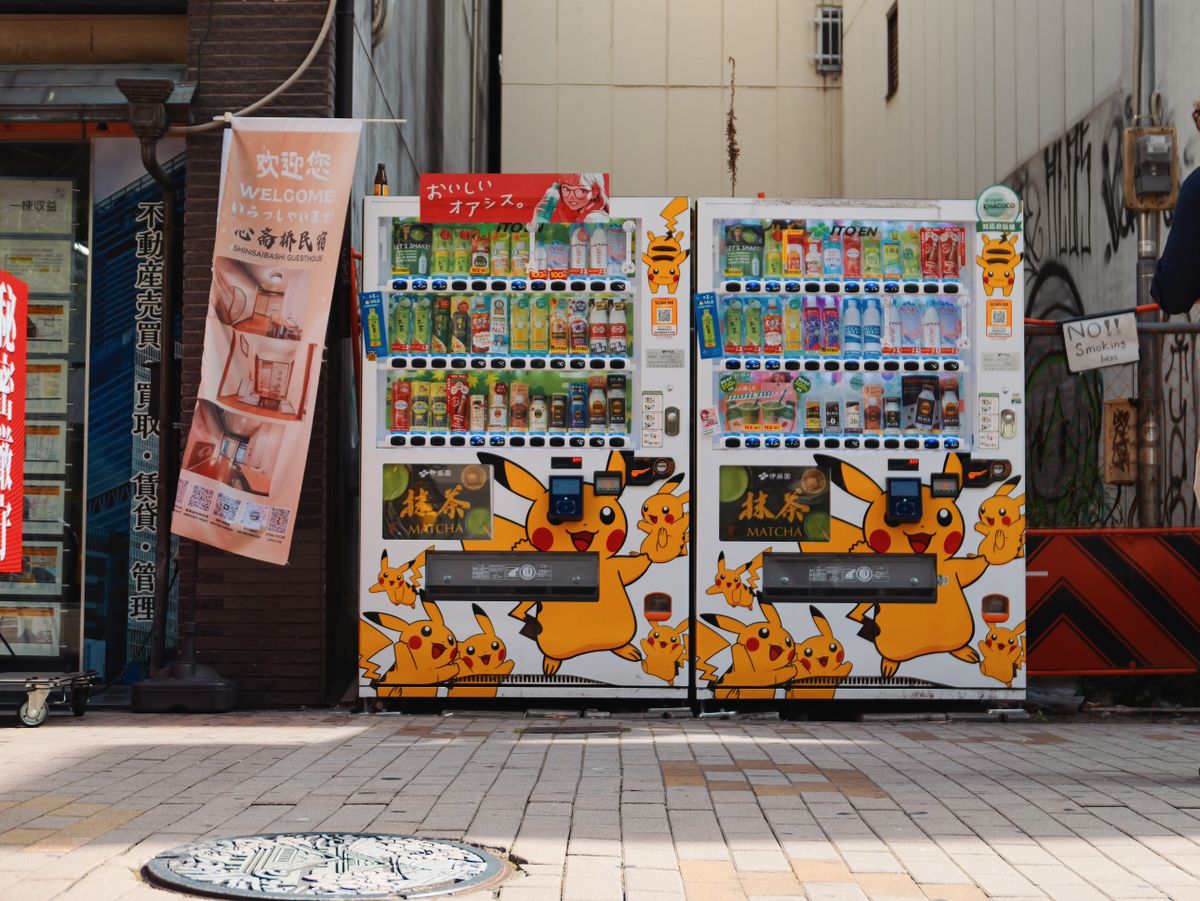 Pikachu-themed vending machines on a Japanese street.