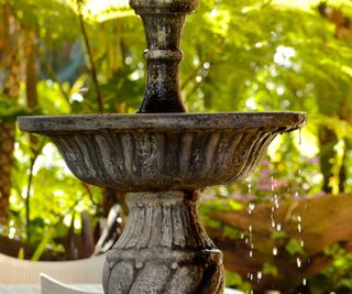 garden fountain that has been weathered to look older