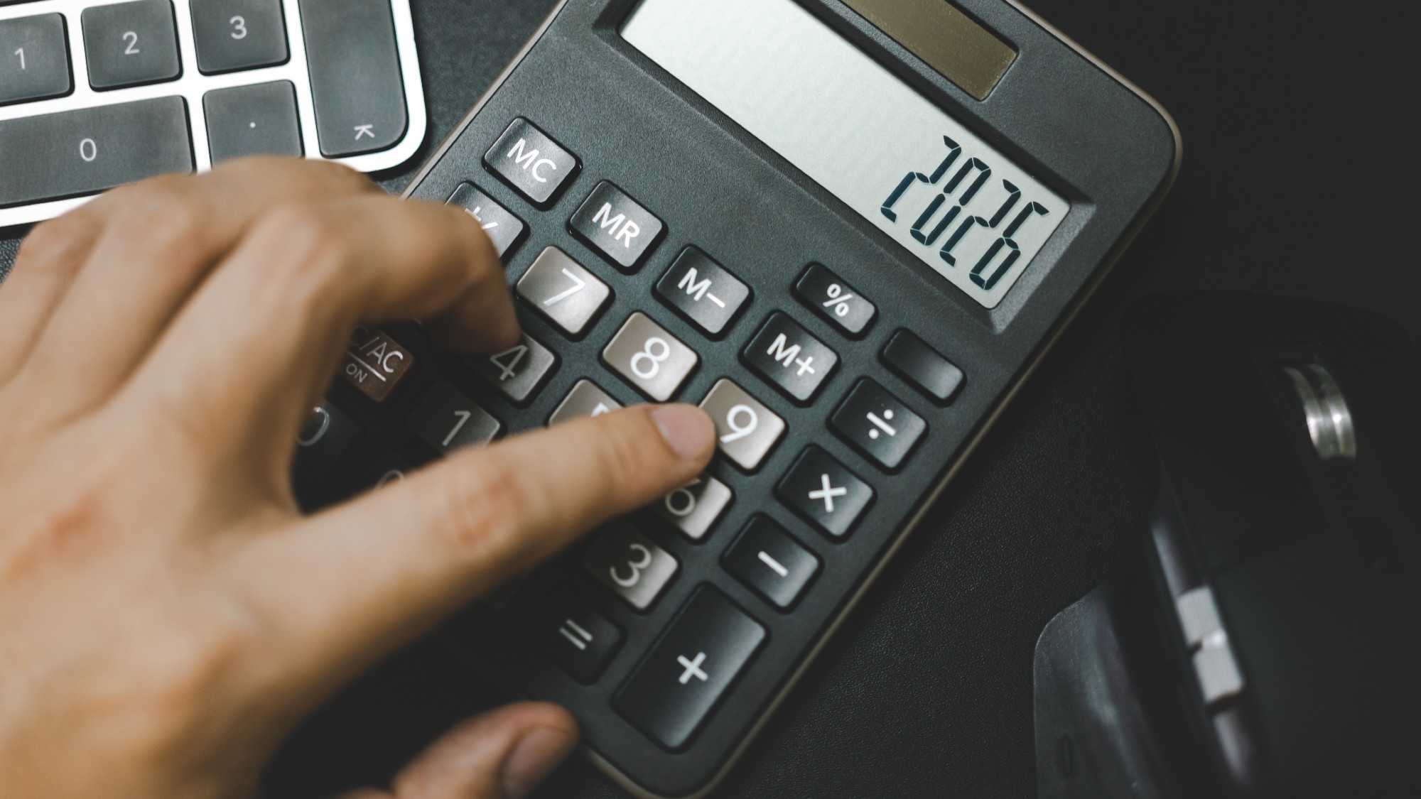 Calculator that reads "2026"