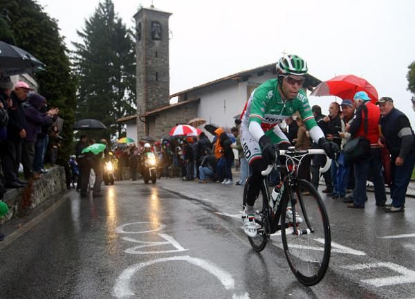 Giovanni Visconti (ISD - Neri) is cheered on by the tifosi at the Madonna del Ghisallo chapel.