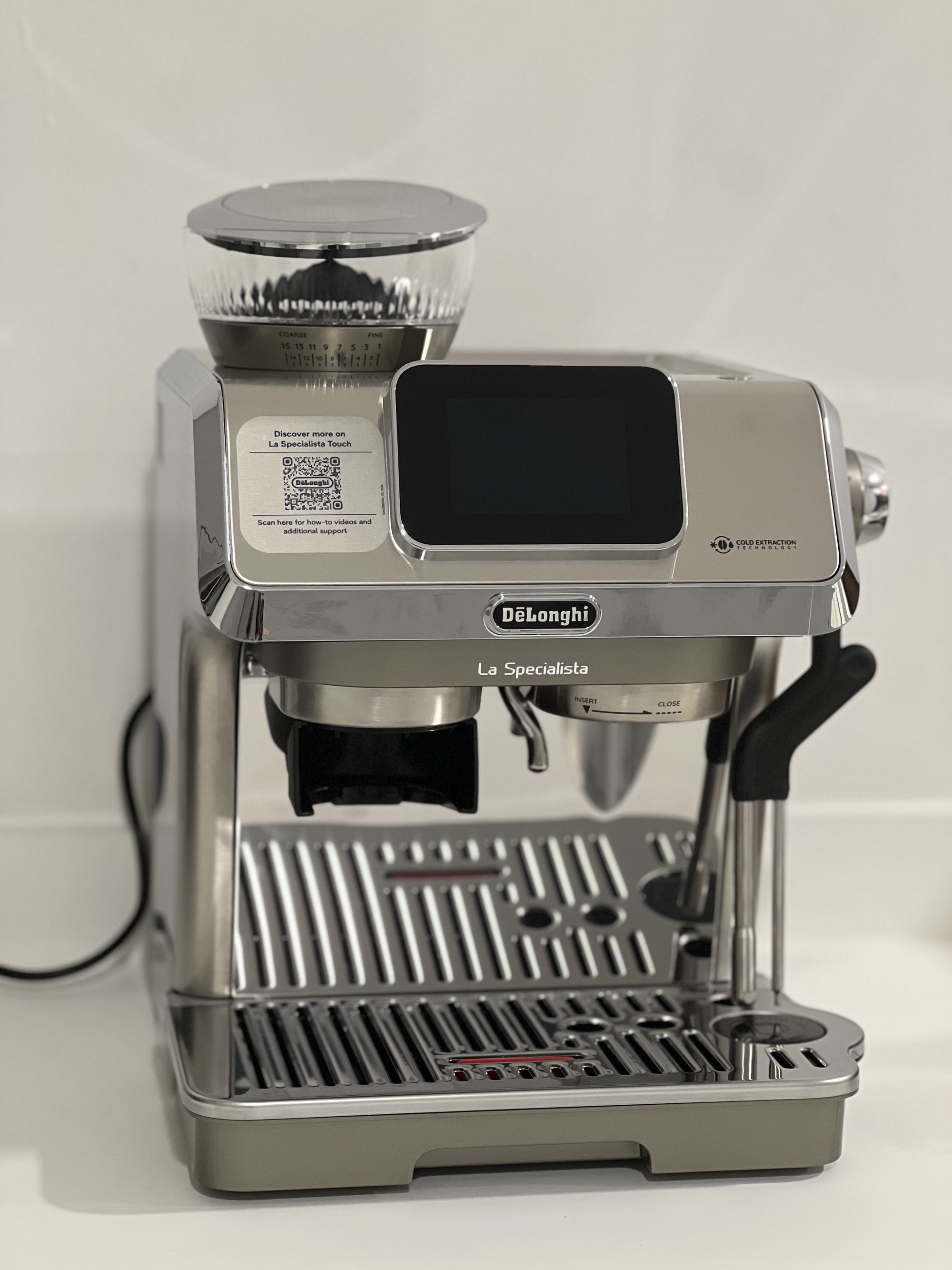 Image of the De'Longhi La Specialista Touch machine in silver on a white countertop