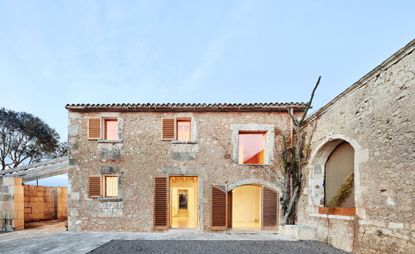 house in a house by MAIO seen at dusk light