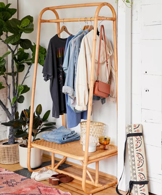 A clothing rack with boho clothing and accessories styled