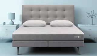 A Sleep Number smart bed on a platform bed with an upholstered headboard