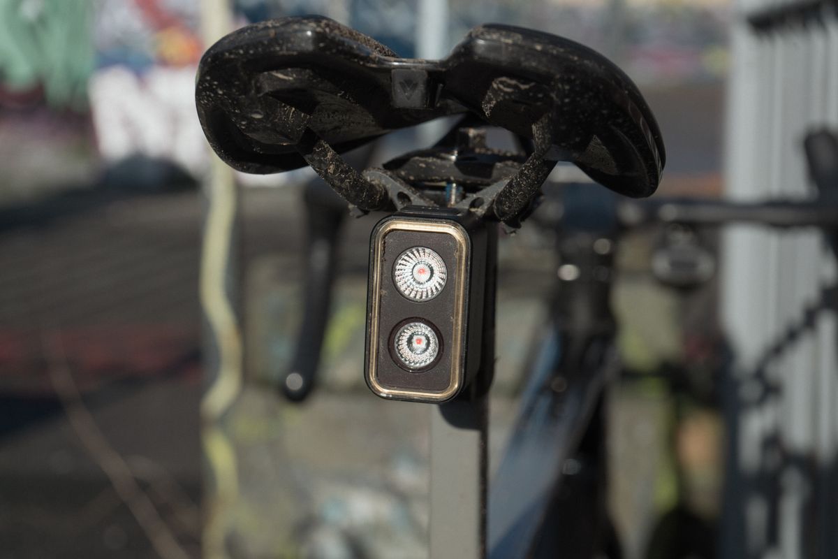 A close up of a rear bike light with two bulbs