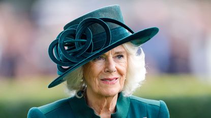 Queen Camilla's suede knee-high boots might be the best black boots we've seen this season - and they're still available to purchase!